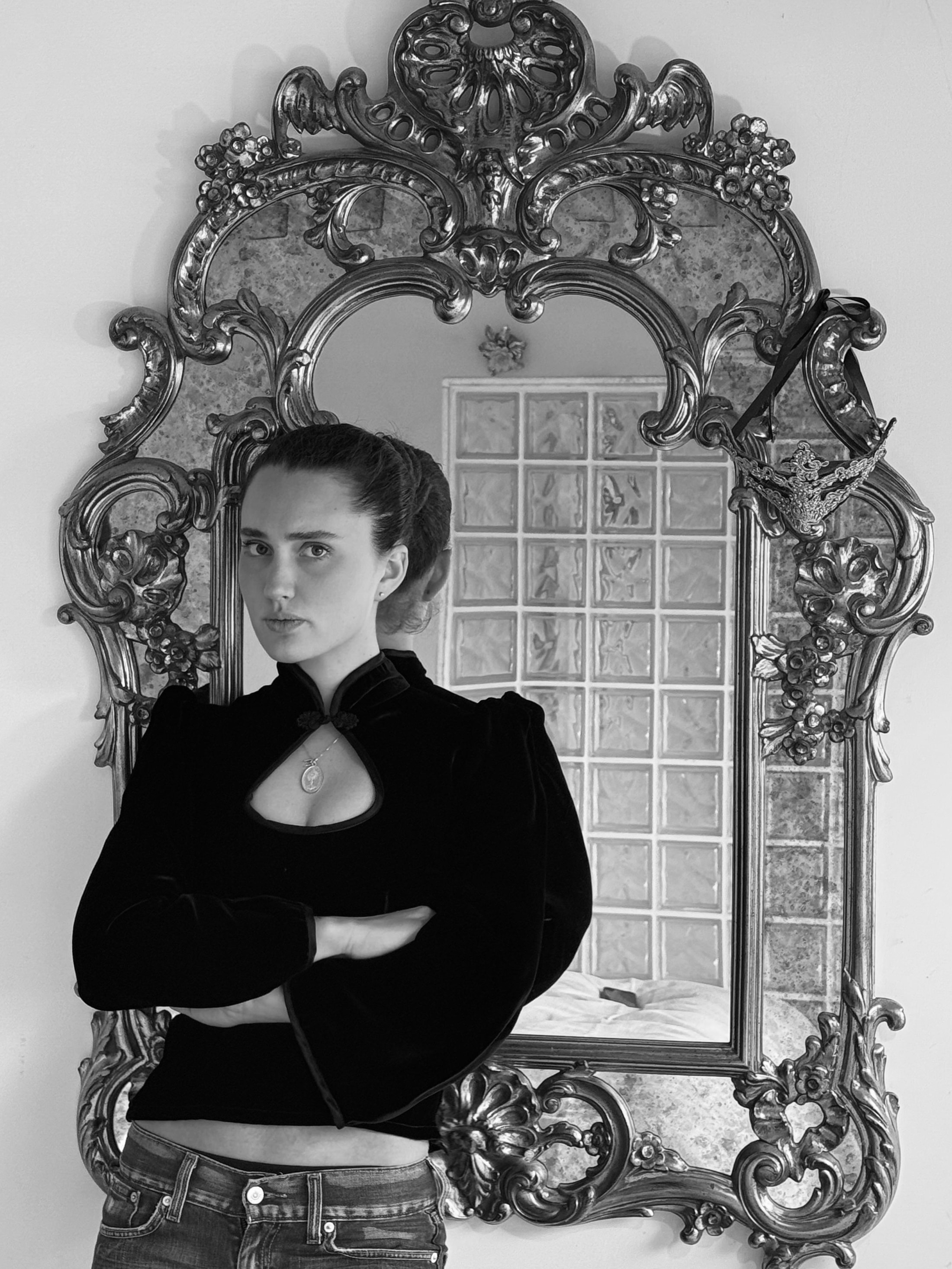 Maria Pia Giustiniani in front of a carved mirror
